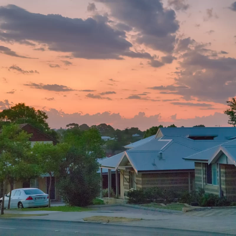 Sunset over houses in Perth suburbs