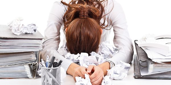 Woman sleeping on paperwork