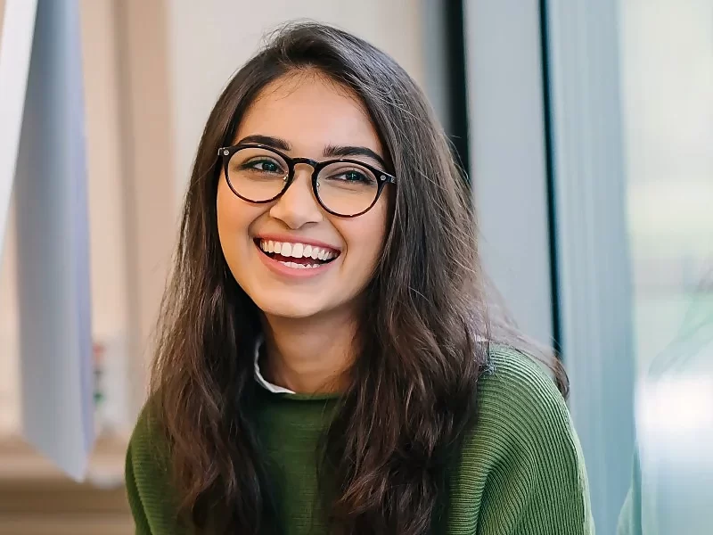 young south asian woman smiling